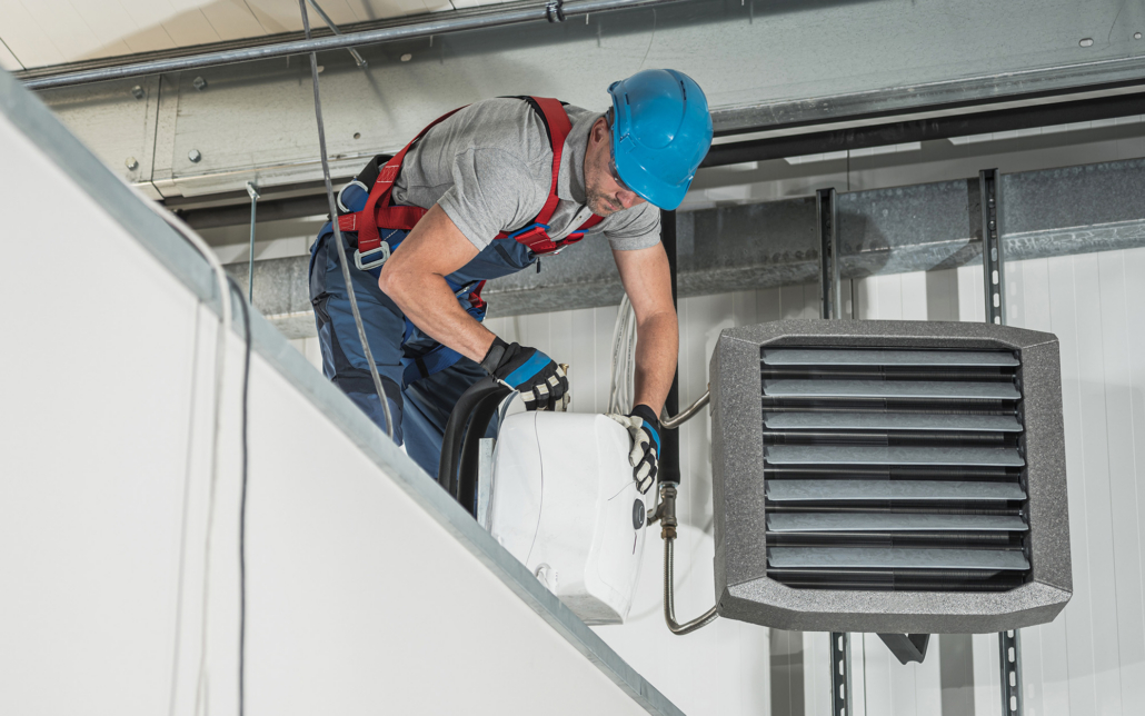 Worker Installing Hvac System